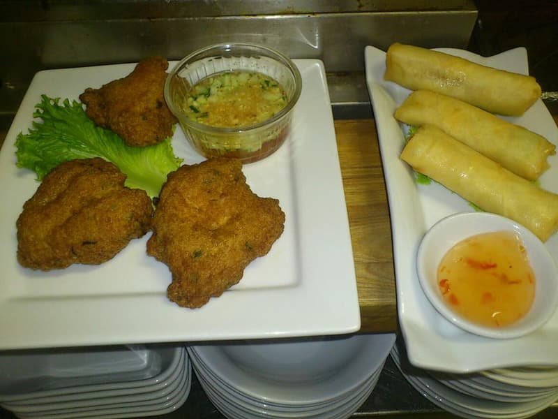 Thai fish cakes and spring rolls appetizer platter